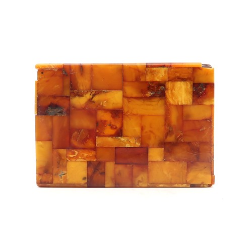 2601A - AN AMBER-TILED CIGARETTE BOXWith plaque affixed to base reading 