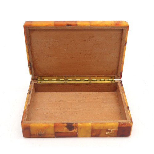 2601A - AN AMBER-TILED CIGARETTE BOXWith plaque affixed to base reading 