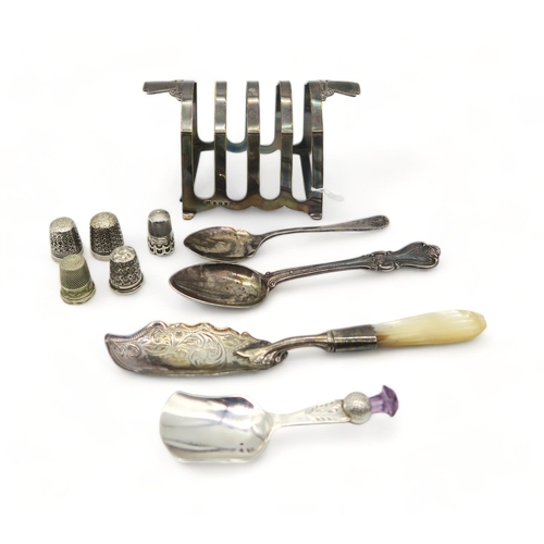 361 - A silver four division toast rack, by William Adam, Birmingham 1935, a silver caddy spoon, by W... 