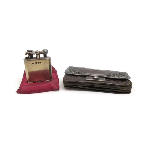 368 - An Edwardian silver lighter, London 1904, and a silver mounted ladies leather purse (2)