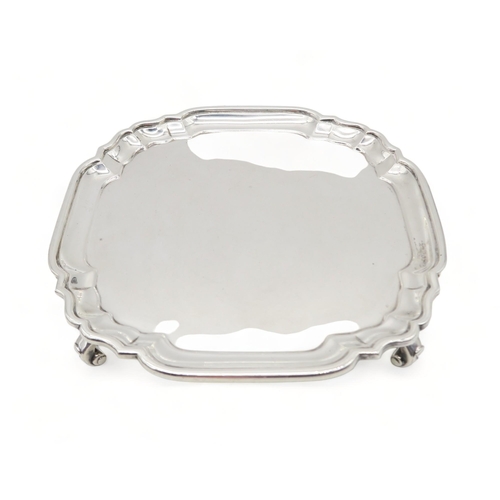 373 - A Britannia standard silver card tray, by Crichton Brothers Ltd, London 1929, on four scroll feet, 1... 