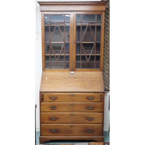 67 - An early 20th century mahogany bureau bookcase with mould cornice over pair of astragal glazed doors... 