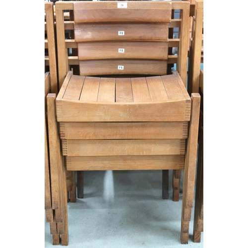 78 - A lot of four 20th century teak stacking church seats with slatted seats on square supports, some wi... 