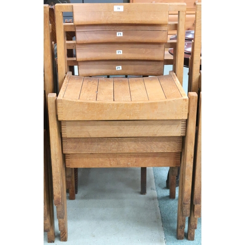 79 - A lot of four 20th century teak stacking church seats with slatted seats on square supports, some wi... 