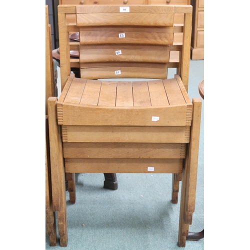 80 - A lot of four 20th century teak stacking church seats with slatted seats on square supports, some wi... 