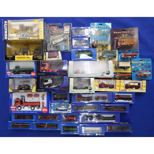 481 - A quantity of boxed scale model vehicles, to include examples by Base-Toys, Ixo, Siku, Newray and ot... 