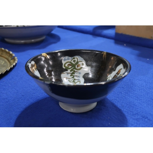 231 - Archie McCall (b.1951) - A large pottery bowl with gilt , green and black decoration on a white grou... 