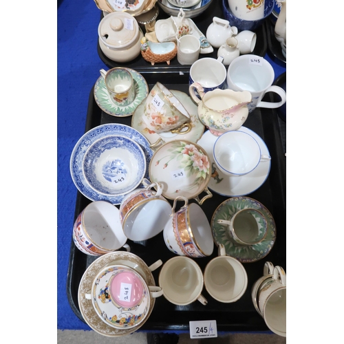 245 - A collection of teawares, a stoneware pot and cover, a cat decorated plate and cover, and assorted o... 