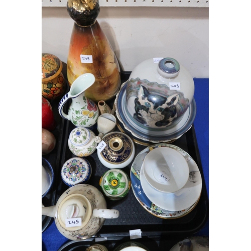 245 - A collection of teawares, a stoneware pot and cover, a cat decorated plate and cover, and assorted o... 