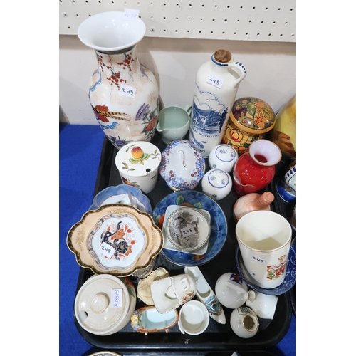 245 - A collection of teawares, a stoneware pot and cover, a cat decorated plate and cover, and assorted o... 