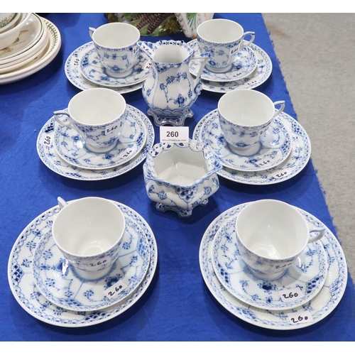 260 - A Royal Copenhagen teaset. comprising six trios, milk jug and sugar bowl in the onion pattern