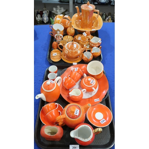 264 - A collection of orange and orange lustre tea and coffee wares including Carlton Ware, Czechoslovakia... 