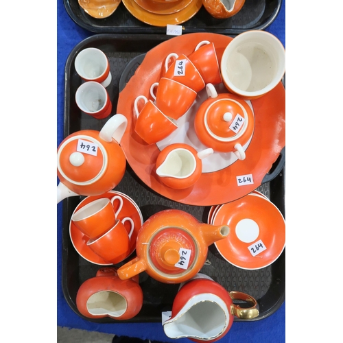 264 - A collection of orange and orange lustre tea and coffee wares including Carlton Ware, Czechoslovakia... 