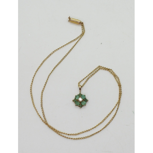 706 - A yellow metal emerald and diamond flower pendant on a 9ct gold Ciro fine curb chain, length 40cm, w... 