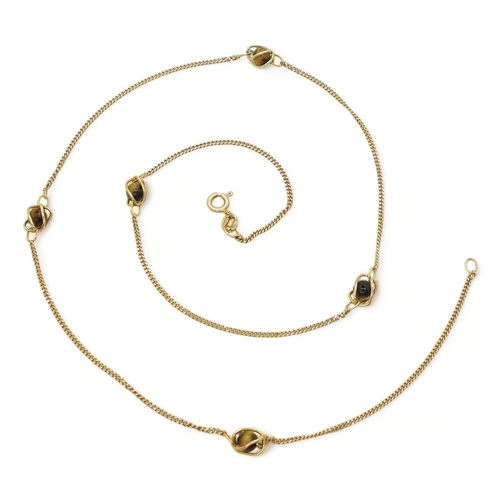 707 - A 9ct gold chain with cage set tiger's eye beads along its length. Length 54cm, weight 5.4gms