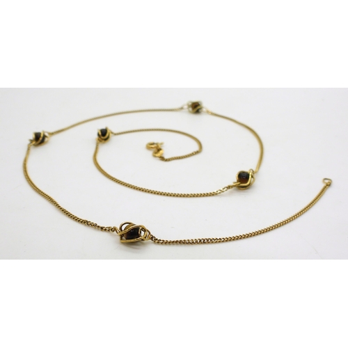 707 - A 9ct gold chain with cage set tiger's eye beads along its length. Length 54cm, weight 5.4gms