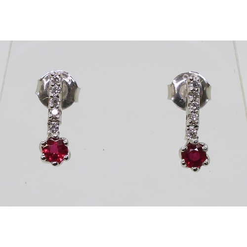 709 - A pair of 18ct white gold, ruby and diamond earrings length 1.3cm, weight 1.8gms