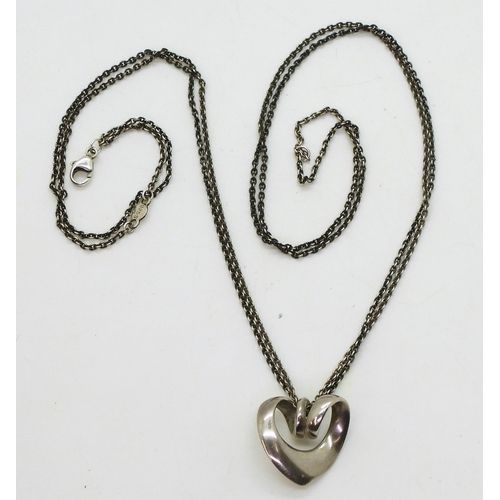 713 - A silver Georg Jensen spiral heart pendant and chain, both the pendant and chain are stamped with th... 