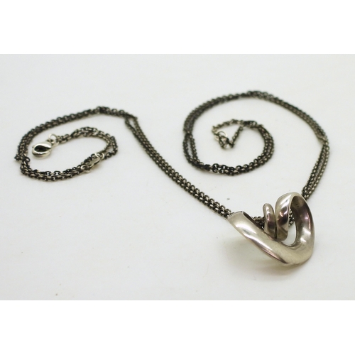 713 - A silver Georg Jensen spiral heart pendant and chain, both the pendant and chain are stamped with th... 