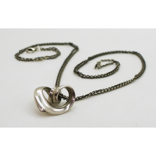 713 - A silver Georg Jensen spiral heart pendant and chain, both the pendant and chain are stamped with th... 