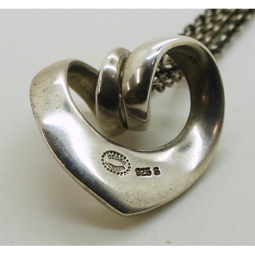 713 - A silver Georg Jensen spiral heart pendant and chain, both the pendant and chain are stamped with th... 