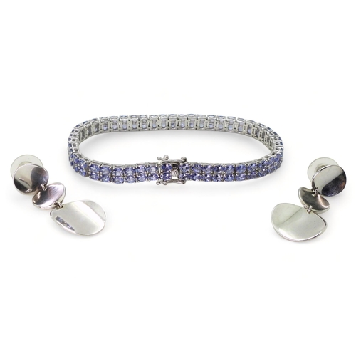 722 - A GemsTV silver tanzanite line bracelet, length 21.5cm, together with a pair of silver disc sta... 