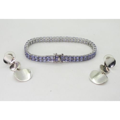 722 - A GemsTV silver tanzanite line bracelet, length 21.5cm, together with a pair of silver disc sta... 