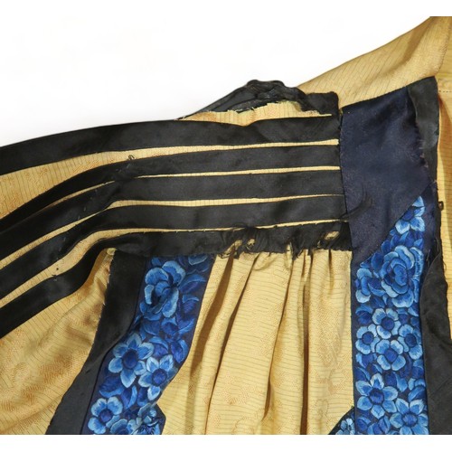 2359A - A CHINESE YELLOW GROUND PLEATED SILK SUMMER ROBEthe damask silk woven with clouds and auspicious obj... 