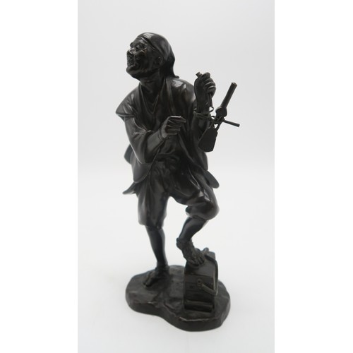 2396A - A JAPANESE BRONZE MODEL OF A MUSICIANstanding and with instrument slung over his shoulder and with o... 