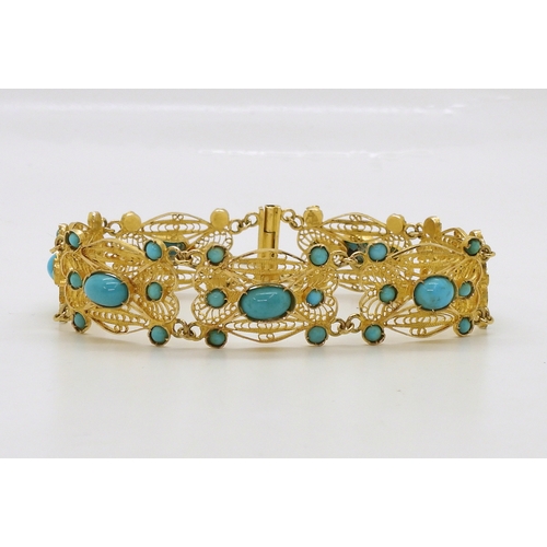 728A - A filigree and turquoise bracelet, made in bright yellow metal stamped with Arabic marks verso and 7... 