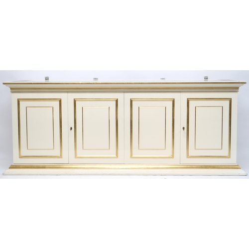 118 - A CONTEMPORARY GILT WHITE VERSACE MIRROR BACK SIDEBOARD mirror with gilt moulded cornice over rectan... 