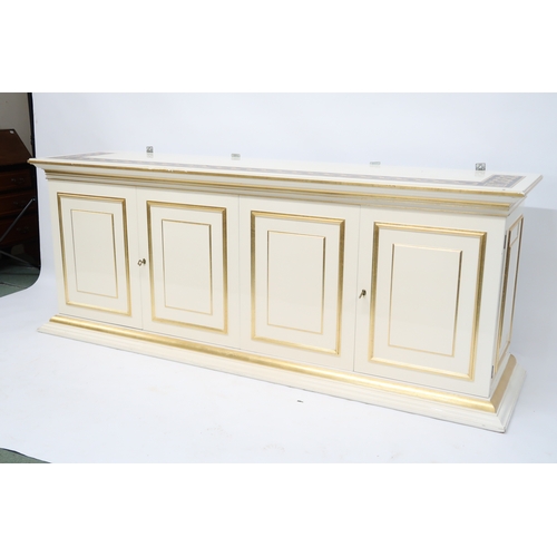 118 - A CONTEMPORARY GILT WHITE VERSACE MIRROR BACK SIDEBOARD mirror with gilt moulded cornice over rectan... 