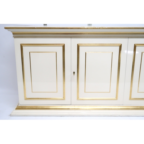 118 - A CONTEMPORARY GILT WHITE VERSACE MIRROR BACK SIDEBOARD mirror with gilt moulded cornice over rectan... 