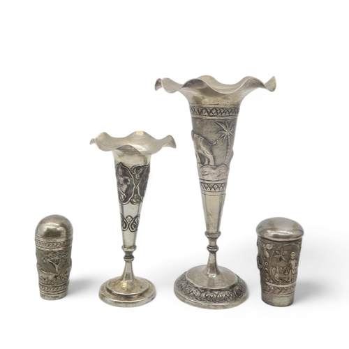 360 - Two Persian white metal trumpet vases, with shaped rims, with two similar walking cane ferrules (4)