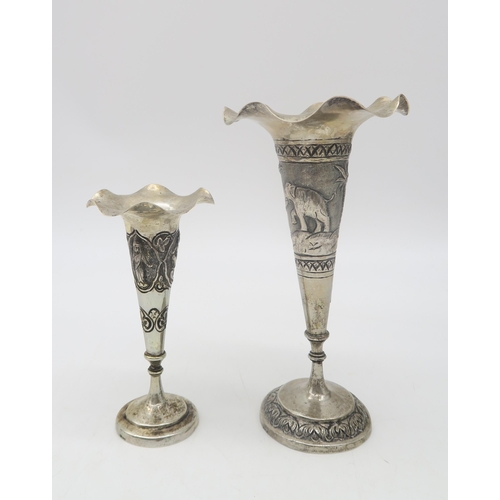 360 - Two Persian white metal trumpet vases, with shaped rims, with two similar walking cane ferrules (4)