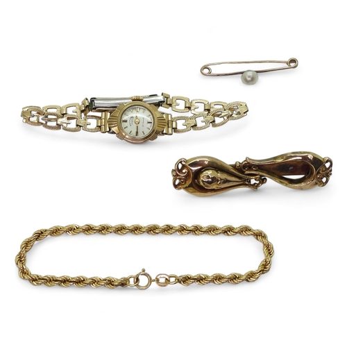 710 - A 9ct gold rope chain bracelet, 9ct faux pearl brooch, a 9ct Rotary watch head with gold plated stra... 