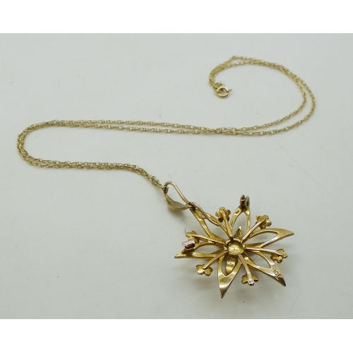 712 - A 9ct gold pearl flower pendant with a 9ct gold rope chain, weight 3.9gms