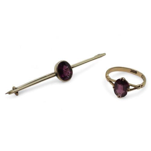 717 - An 18ct gold garnet set ring, size L, together with a similar yellow metal brooch weight together 5g... 