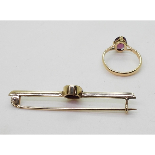 717 - An 18ct gold garnet set ring, size L, together with a similar yellow metal brooch weight together 5g... 