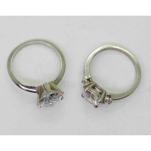 720 - Two white metal mounted 'Tru Diamonds' diamond simulant rings, a solitaire size M1/2, ans a three st... 