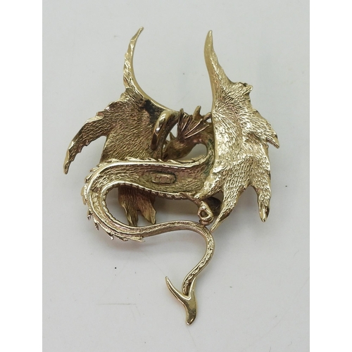 726 - A 9ct gold dragon pendant, dimensions 5.2cm x 3.5cm, weight 10.4gms