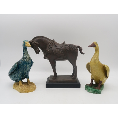 236 - A Chinese style pottery horse, a pair of Fo dos, two ducks and a resin horse