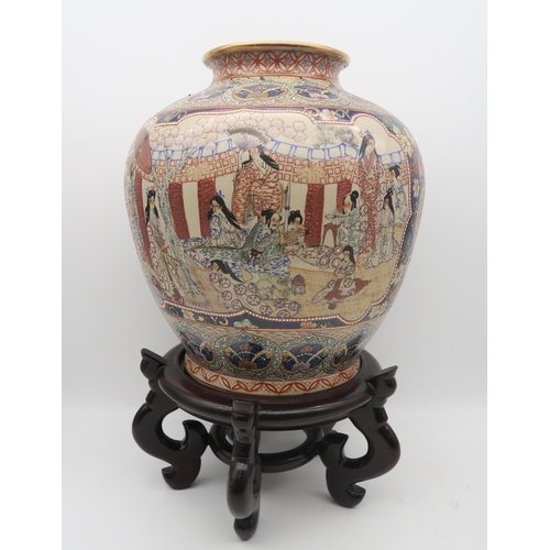 245 - A Chinese jar on stand, a blue and white vase on stand and a teapot within in wicker case