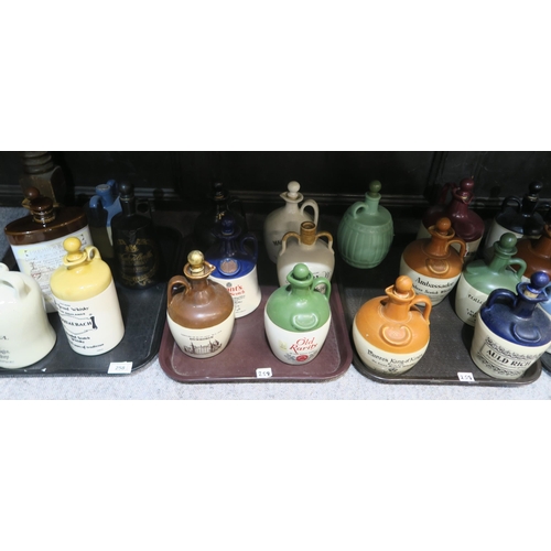 258 - A collection of pottery decanters for various whisky's