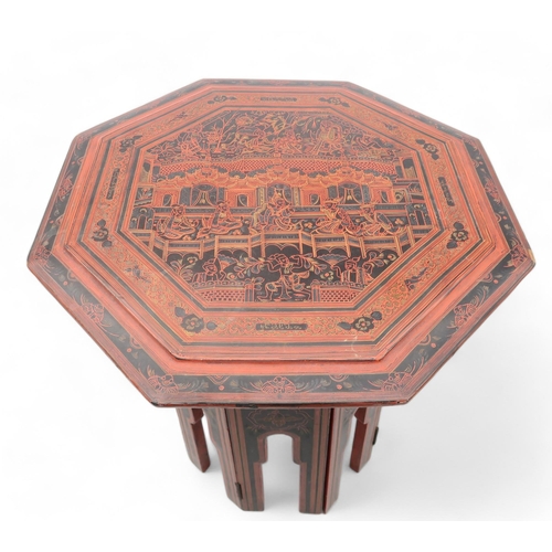 269 - A small lacquered Chinese table with octagonal table