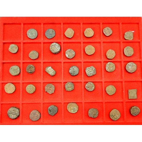 435 - A collection of Indian Sub Continent coins with examples from Indian Mughal Empire and Princely Stat... 