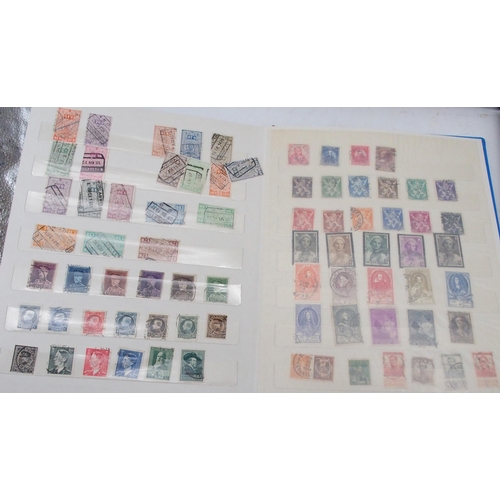 452 - A worldwide collection of stamps in five albums with early Great Britain, Australia, Belgium, Britis... 