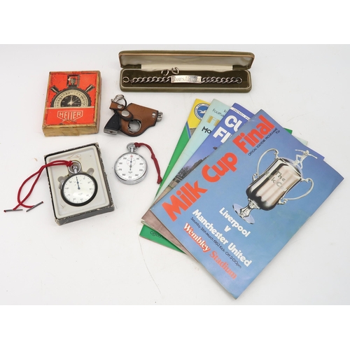 558 - A London silver ID bracelet, two stopwatches by Heuer, four various football programmes and a pistol... 