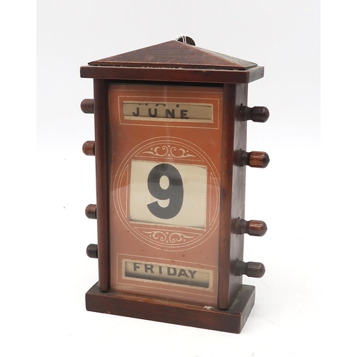 559 - An Edwardian perpetual desk calendar, measuring approx. 22cm in height