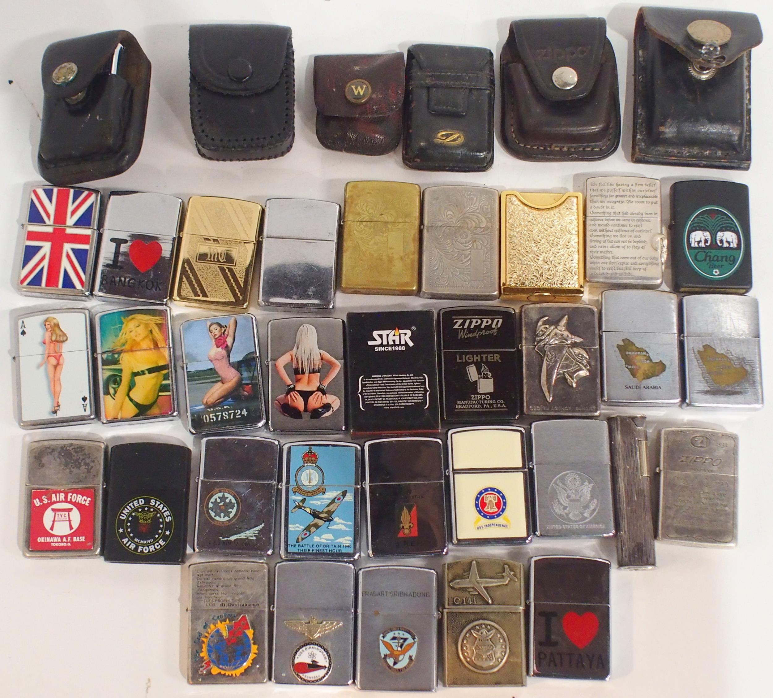 A Collection Of Cigarette Lighters Comprising Silver Plated Examples